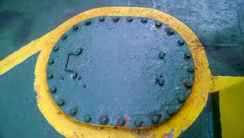 Technological hatch on the deck of the ship. Service inputs. photo