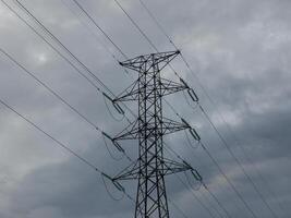 High voltage post. High voltage tower. Electricity distribution station photo