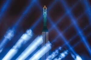 Illuminated Freedom Monument in Riga Celebrating Latvia's Independence Day photo