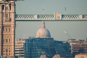 Experience London's Tower Bridge and St. Paul's Cathedral during Golden Hour. photo