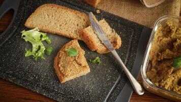 homemade meat pate with bread on a wooden table video