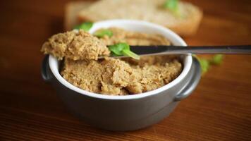 homemade meat pate in a ceramic bowl on a wooden table video