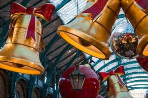 Golden Bells, Red Baubles Adorn Christmas Decor at London's Market photo