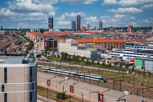Cityscape at Daytime Featuring a Train, Located in Copenhagen. photo