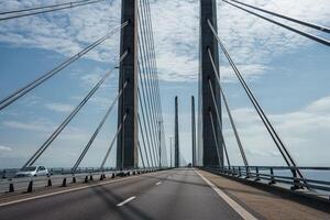 Modern Oresund Bridge Connecting Copenhagen and Malmo on a Clear Day photo