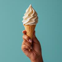 AI generated hand holding an ice cream in front of a bluish background photo