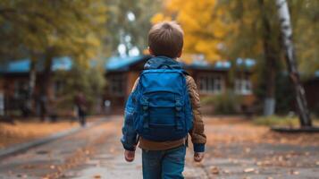 AI generated A boy with a blue school backpack joyfully walks to school photo