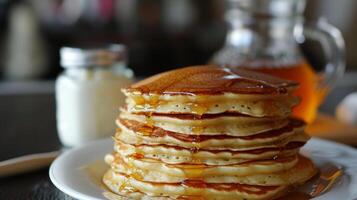 AI generated a stack of fresh thick pancakes in the kitchen next to a jar of honey and sour cream photo