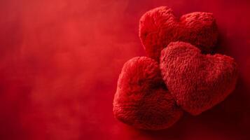 AI generated Two red plush hearts on a minimalistic red background with plenty of space for text photo