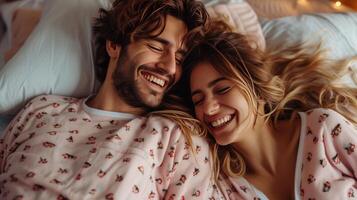 AI generated A happy couple in matching pajamas laughs while lying in bed photo