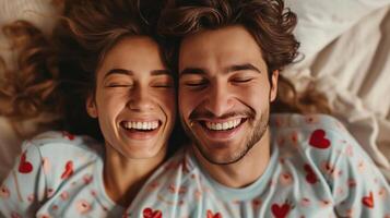 AI generated A happy couple in matching pajamas laughs while lying in bed photo