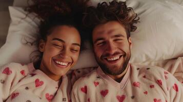 AI generated A happy couple in matching pajamas laughs while lying in bed photo