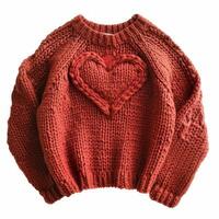 AI generated Cute knitted sweater in a heart isolated photo