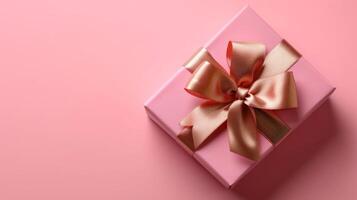 AI generated Pink gift box with gold silk bow on isolated pink background photo