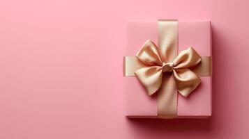 AI generated Pink gift box with gold silk bow on isolated pink background photo