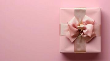 AI generated Pink gift box with gold silk bow on isolated pink background photo