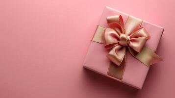 AI generated Pink gift box with gold silk bow on isolated pink background photo