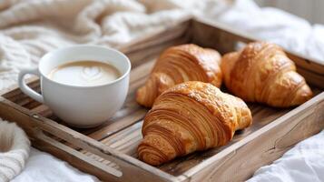 ai generado un de madera bandeja con café y croissants para desayuno en cama foto