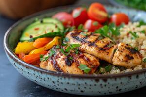 AI generated a well-portioned plate featuring grilled chicken, quinoa, and steamed vegetables photo