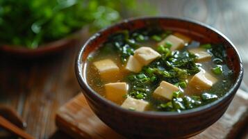 AI generated A classic bowl of miso soup, with tofu and seaweed floating in a savory broth. photo