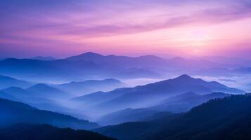 ai generado montaña niebla a amanecer. sombras de púrpura y azul envuelto en niebla evocar el majestad de montañas a amanecer. foto