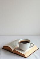 ai generado un minimalista representación de un abierto libro y un taza de café en un blanco antecedentes foto