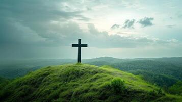 AI generated A Christian cross standing tall atop a lush green hill. large copyspace area photo