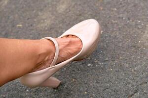 Women's problems. Fatigue of legs, heels. Beige shoes photo