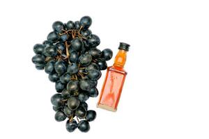 Good old brandy, cognac and black ripe grapes photo