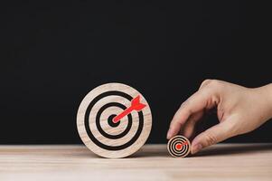 Determination and success. Two wooden circles with target icons of different sizes. concepts of methods and planning for setting goals starting from small goals to big goals. photo