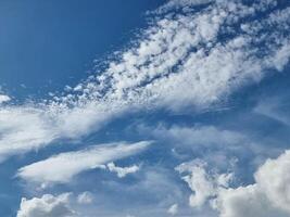 abstract outdoor blue sky high and long white clouds background in summer gradient light beauty background. beautiful bright cloud and calm fresh wind air photo