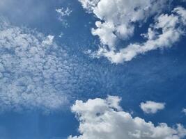 abstract blue sky high white group shape clouds background in summer gradient light beauty background. beautiful bright cirrostratus cloud and calm fresh wind air photo