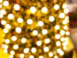 abstract bokeh blur light circle golden orange and white glowing flare pattern black background photo