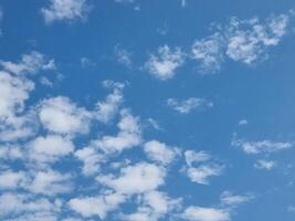 abstract outdoor sunny day blue sky high small group clouds background in summer gradient light white background. beautiful bright cloud and calm fresh wind air. photo