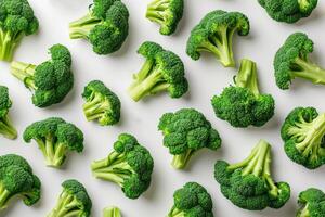 ai generado un pila de brócoli floretes en un blanco superficie Fresco brócoli floretes arreglado pulcramente en un limpiar blanco superficie. foto