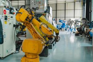 Industrial robot arm storage, product distribution Robot concept, Concept of artificial intelligence for the industrial revolution, and automation manufacturing process. photo