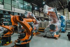 Industrial robot arm storage, product distribution Robot concept, Concept of artificial intelligence for the industrial revolution, and automation manufacturing process. photo