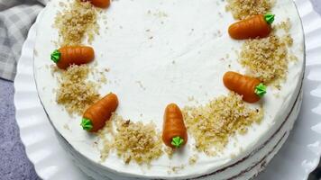 Homemade Easter carrot cake made with walnuts, iced with cream cheese. video