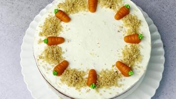 Homemade Easter carrot cake made with walnuts, iced with cream cheese. video