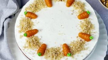 Homemade Easter carrot cake made with walnuts, iced with cream cheese. video