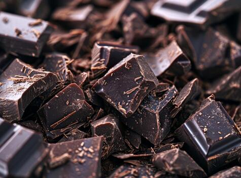 AI generated Pieces of dark chocolate on table closeup Food background photo