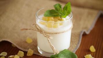 Sweet homemade yogurt with candied fruits in a glass video