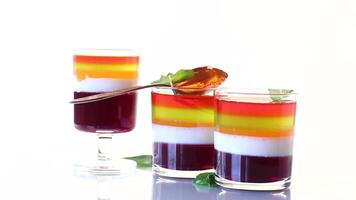 lot of colored sweet fruit jelly in a glass video