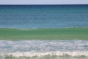 Beach front sand and waves photo