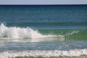 Beach front sand and waves photo