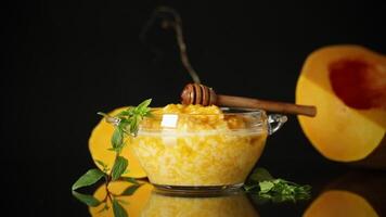 sweet boiled pumpkin porridge in a bowl with honey video