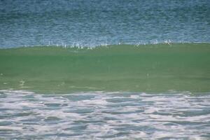 Beach front sand and waves photo