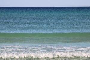 Beach front sand and waves photo