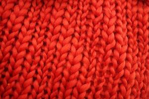 Red Knit Sweater Closeup Texture photo