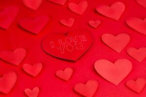 Photo of a paper heart shape on a red background.